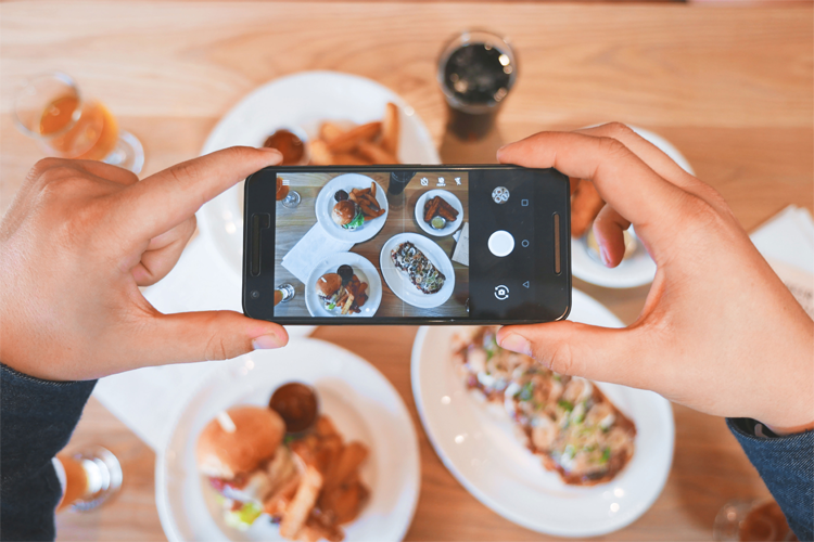 Photo of smartphone taking picture of food